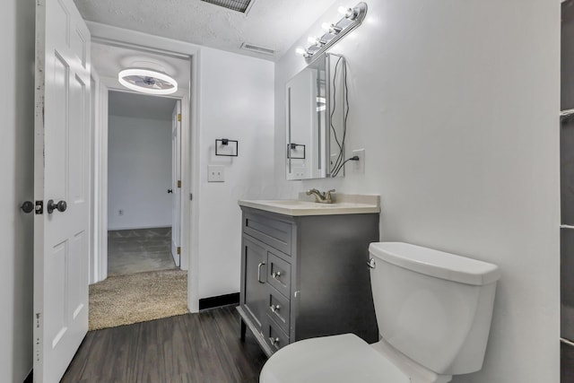 625 Country Club Dr Unit E4, Newark, OH 43055 - half bath featuring wood finished floors, toilet, and vanity