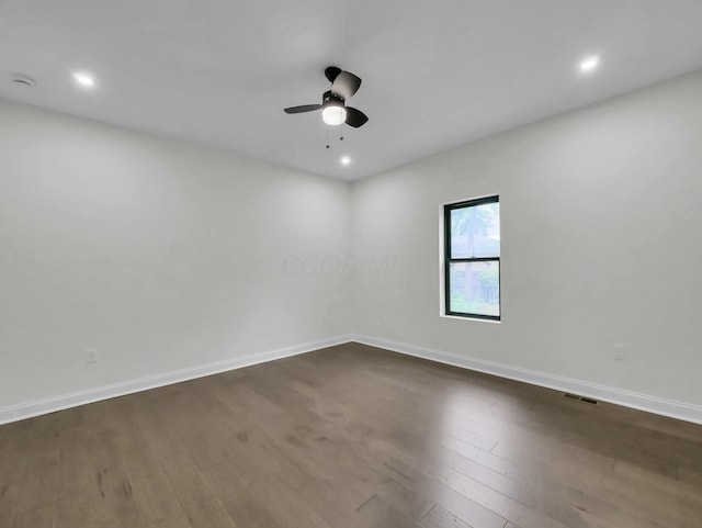 1292 Moundview Ave, Columbus, OH 43207 - empty room with dark wood-style flooring, ceiling fan, baseboards, recessed lighting, and a smoke detector