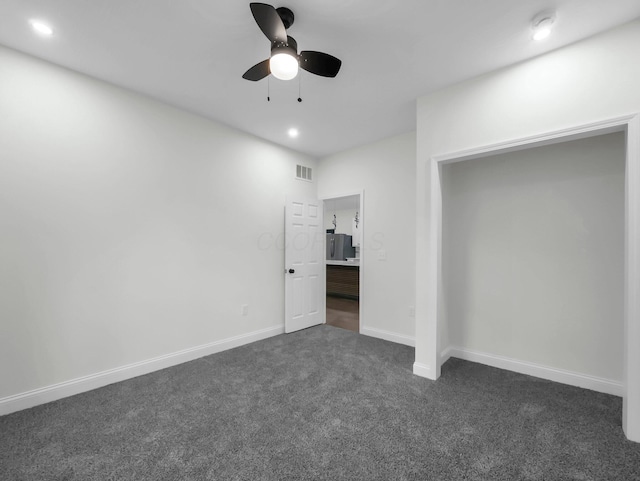 1292 Moundview Ave, Columbus, OH 43207 - unfurnished bedroom featuring freestanding refrigerator, dark carpet, recessed lighting, baseboards, and ceiling fan