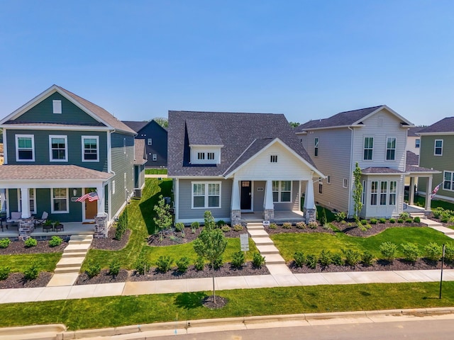 5599 Piatt Rd, Lewis Center, OH 43035 - craftsman inspired home featuring a porch, a front lawn, and a shingled roof