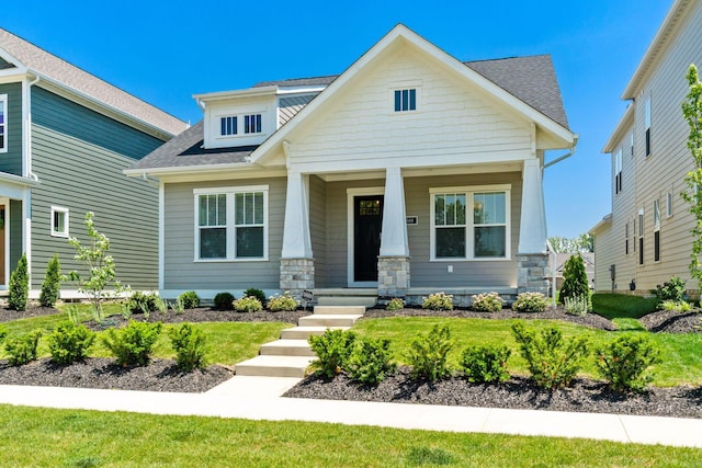 5599 Piatt Rd, Lewis Center, OH 43035 - craftsman-style house with a shingled roof, a porch, and stone siding