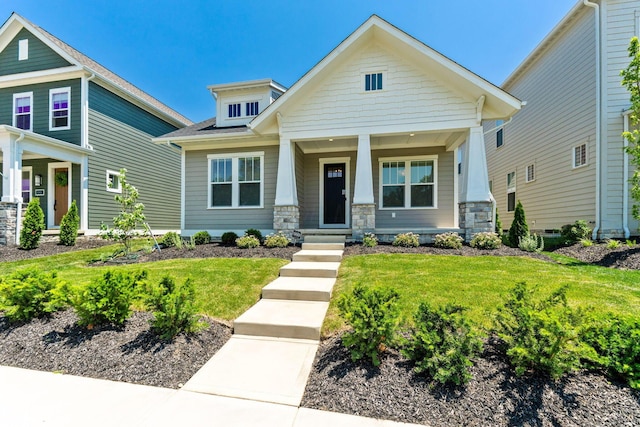 5599 Piatt Rd, Lewis Center, OH 43035 - craftsman house with a porch, stone siding, and a front lawn