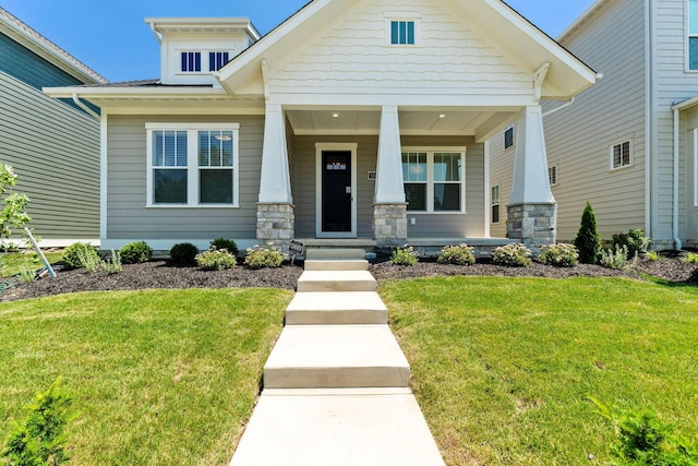 5599 Piatt Rd, Lewis Center, OH 43035 - craftsman-style house with stone siding, covered porch, and a front yard