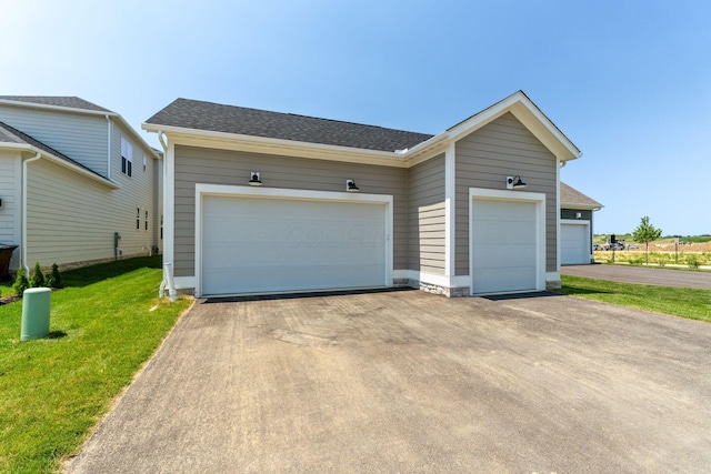 5599 Piatt Rd, Lewis Center, OH 43035 - view of front of home with a front lawn, driveway, roof with shingles, and an attached garage