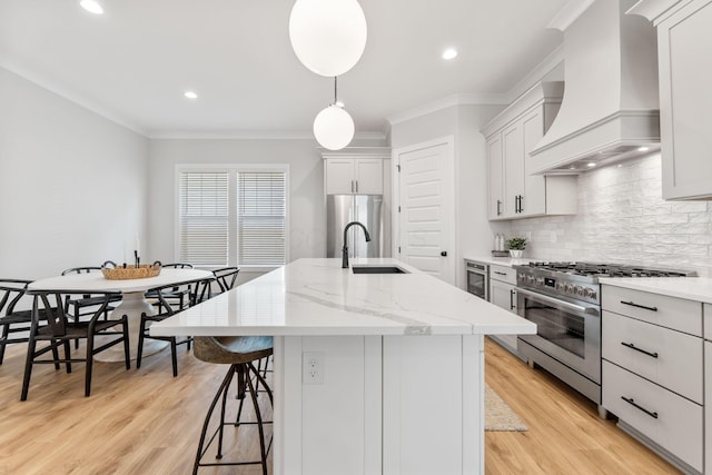 5599 Piatt Rd, Lewis Center, OH 43035 - kitchen with stainless steel appliances, custom exhaust hood, a kitchen island with sink, ornamental molding, and tasteful backsplash