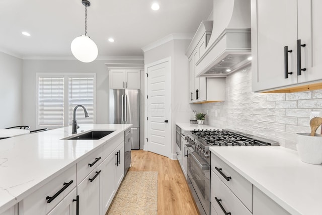 5599 Piatt Rd, Lewis Center, OH 43035 - kitchen featuring appliances with stainless steel finishes, crown molding, premium range hood, decorative backsplash, and pendant lighting