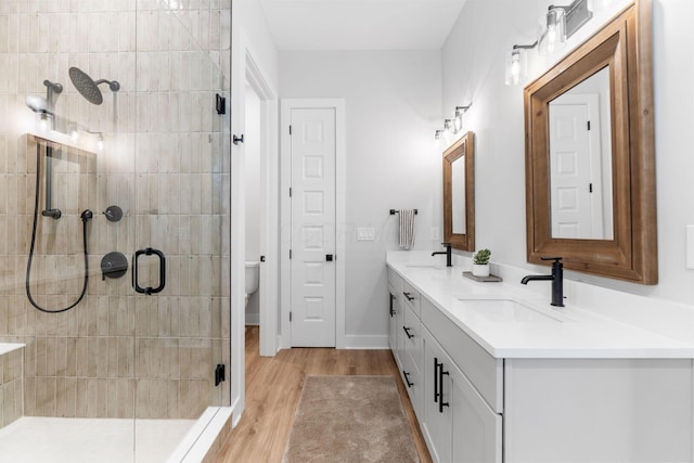 5599 Piatt Rd, Lewis Center, OH 43035 - full bathroom with double vanity, a stall shower, and wood finished floors