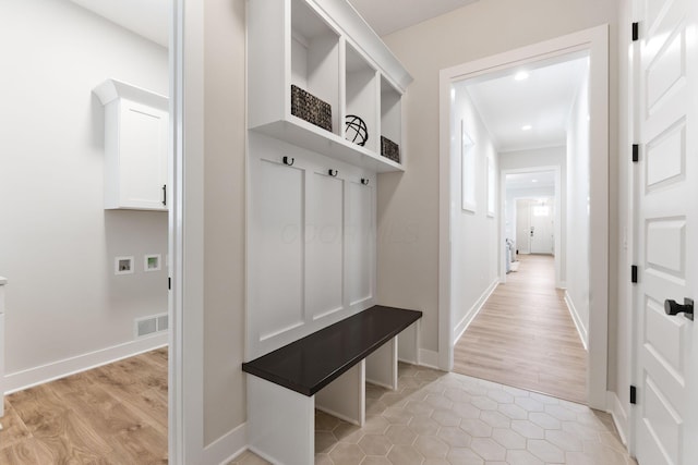 5599 Piatt Rd, Lewis Center, OH 43035 - mudroom with light wood finished floors and baseboards