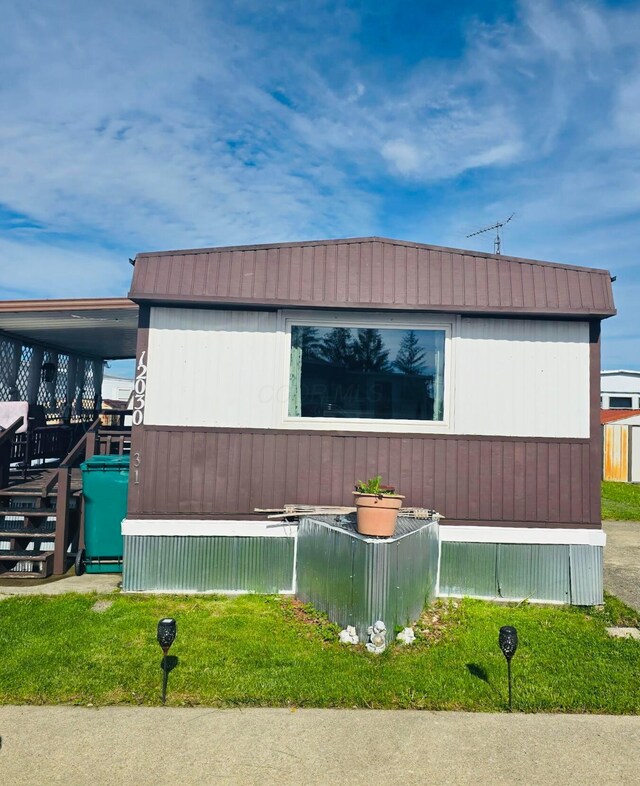 12030 Holly Dr Unit 31, Lakeview, OH 43331 - view of home's exterior with metal roof