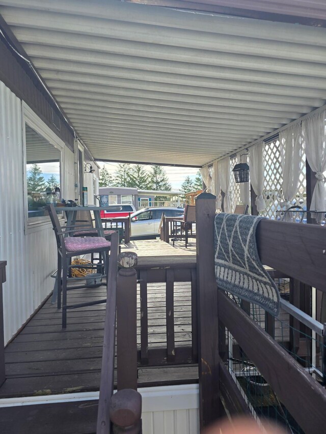 12030 Holly Dr Unit 31, Lakeview, OH 43331 - wooden deck with a carport