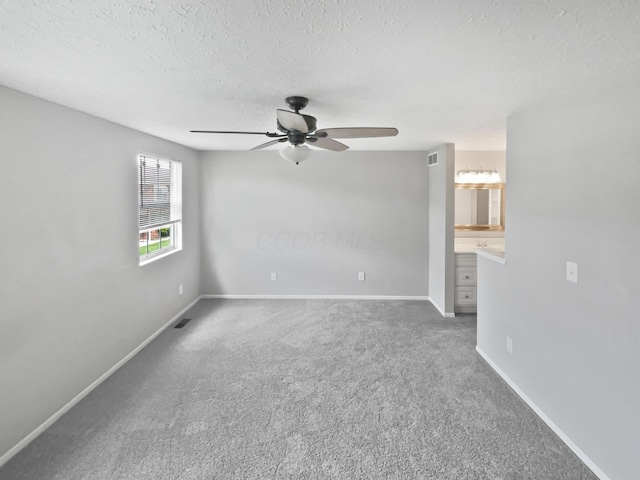 1813 Worthington Run Dr Unit A, Columbus, OH 43235 - carpeted spare room with a ceiling fan, a textured ceiling, and baseboards