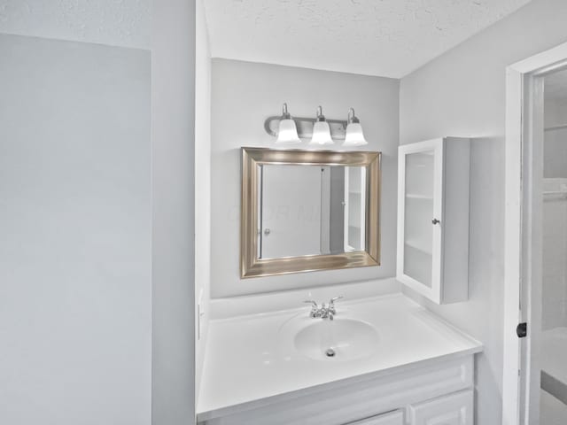 1813 Worthington Run Dr Unit A, Columbus, OH 43235 - bathroom with a textured ceiling and vanity