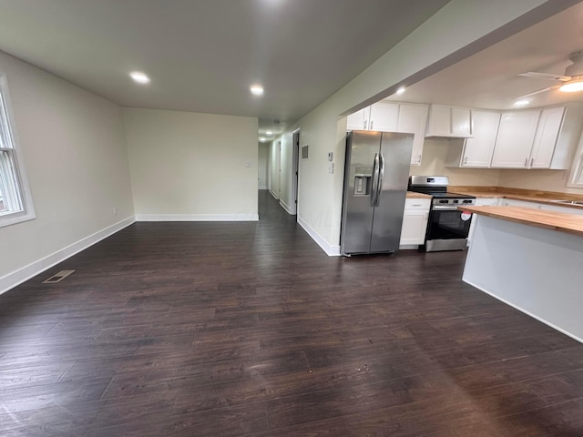 1227 Brown Rd, Columbus, OH 43223 - kitchen with appliances with stainless steel finishes, butcher block countertops, white cabinetry, recessed lighting, and dark wood-type flooring