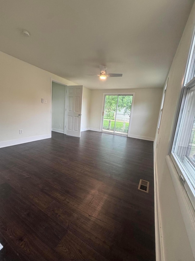 1227 Brown Rd, Columbus, OH 43223 - unfurnished room featuring dark wood-type flooring, a ceiling fan, and baseboards