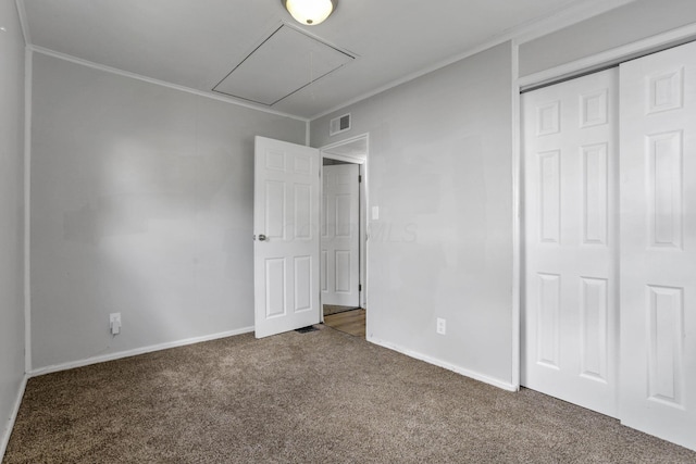 392 S Hampton Rd, Columbus, OH 43213 - unfurnished bedroom featuring attic access, carpet flooring, a closet, baseboards, and crown molding
