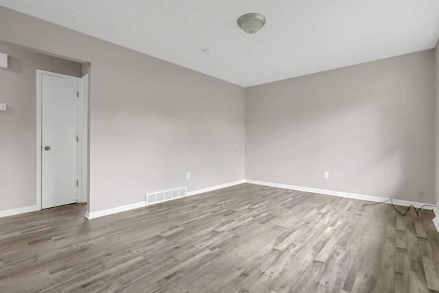 3197 E Ave, Columbus, OH 43207 - unfurnished room featuring wood finished floors and baseboards