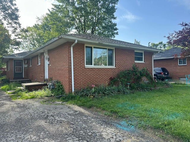 130-132 Collingwood Ave, Columbus, OH 43213 - view of home's exterior featuring brick siding and a lawn