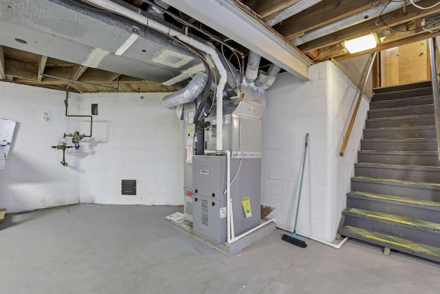 4648 E Johnstown Rd, Columbus, OH 43230 - unfinished below grade area featuring heating unit, stairway, and concrete block wall