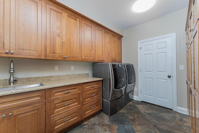 366 W S St, Worthington, OH 43085 - washroom featuring cabinet space, washer and clothes dryer, and stone finish floors