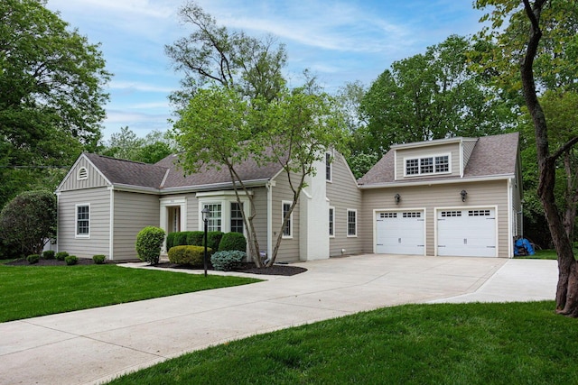 366 W S St, Worthington, OH 43085 - view of front of property with concrete driveway, a garage, a front yard, a shingled roof, and board and batten siding