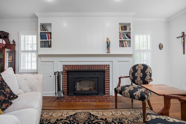 366 W S St, Worthington, OH 43085 - living room featuring a fireplace, wood finished floors, ornamental molding, and healthy amount of natural light