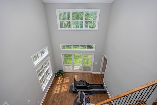 366 W S St, Worthington, OH 43085 - living room featuring a high ceiling, plenty of natural light, wood finished floors, and stairs