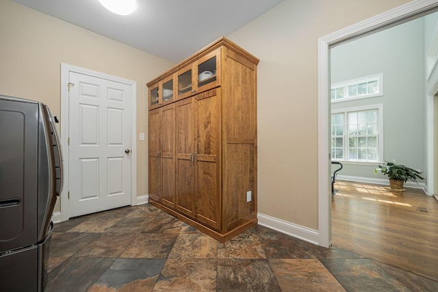 366 W S St, Worthington, OH 43085 - laundry room with cabinet space, dark stone finish floors, and washer / dryer