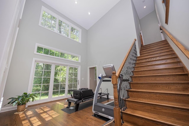 366 W S St, Worthington, OH 43085 - staircase featuring high vaulted ceiling, wood finished floors, and recessed lighting