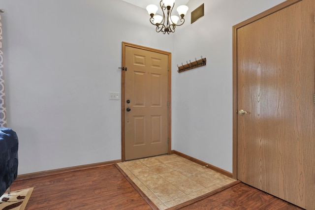 4966 Brice Creek Dr, Canal Winchester, OH 43110 - entryway featuring a chandelier, baseboards, and wood finished floors