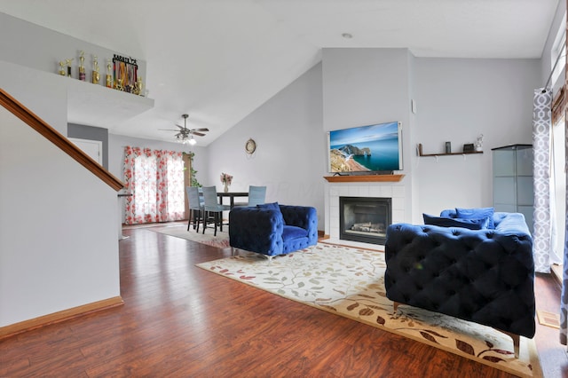 4966 Brice Creek Dr, Canal Winchester, OH 43110 - living area featuring ceiling fan, wood finished floors, a tiled fireplace, and high vaulted ceiling