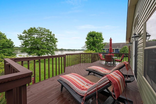 1244 E Choctaw Dr, London, OH 43140 - wooden terrace featuring a water view, outdoor dining space, and a lawn
