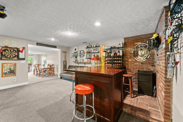 1244 E Choctaw Dr, London, OH 43140 - indoor dry bar with a textured ceiling, carpet flooring, baseboards, and recessed lighting