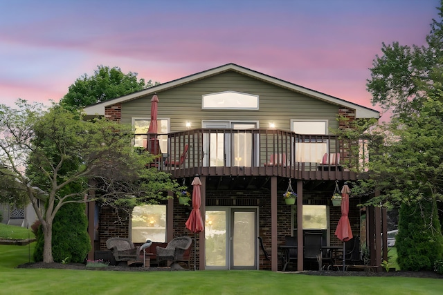 1244 E Choctaw Dr, London, OH 43140 - rear view of property featuring a deck and brick siding