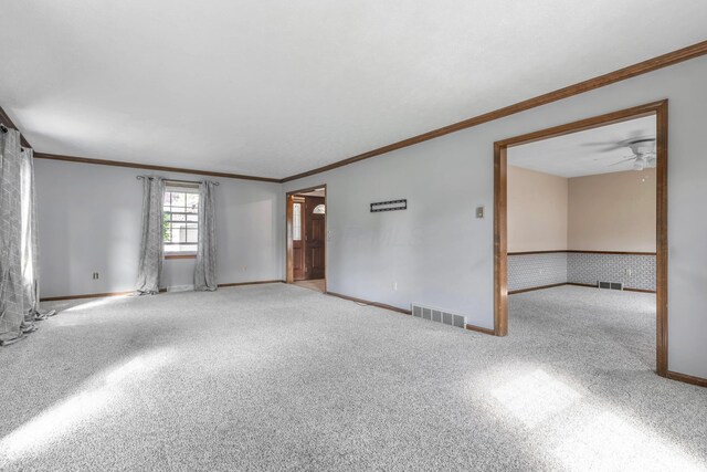 1541 Kensington Ln, Lancaster, OH 43130 - spare room featuring ornamental molding, carpet, baseboards, and ceiling fan