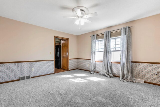 1541 Kensington Ln, Lancaster, OH 43130 - carpeted spare room with a wainscoted wall, ceiling fan, and wallpapered walls
