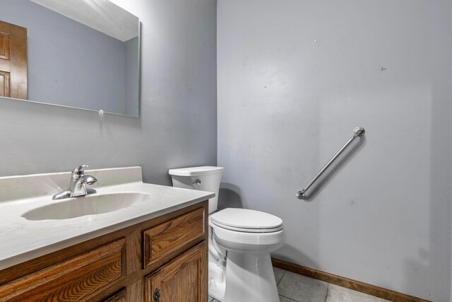 1541 Kensington Ln, Lancaster, OH 43130 - half bath featuring tile patterned flooring, toilet, vanity, and baseboards