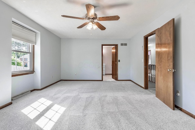 1541 Kensington Ln, Lancaster, OH 43130 - empty room featuring carpet floors, ceiling fan, baseboards, and a baseboard radiator