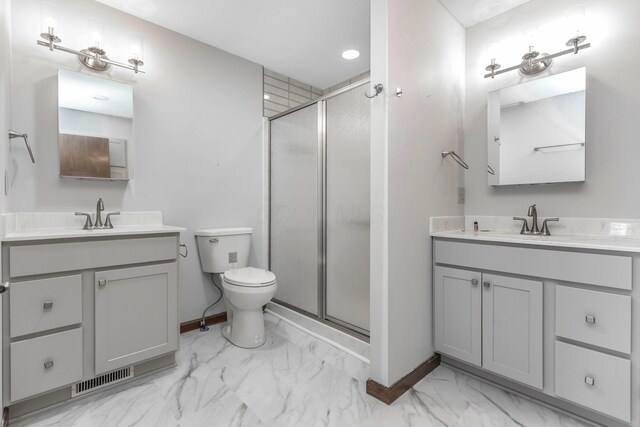 1541 Kensington Ln, Lancaster, OH 43130 - bathroom with marble look tile flooring, a shower stall, baseboards, two vanities, and toilet