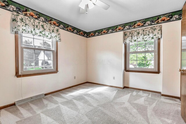 1541 Kensington Ln, Lancaster, OH 43130 - carpeted empty room featuring baseboard heating, ceiling fan, and baseboards