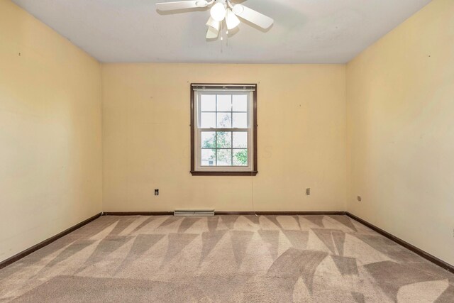 1541 Kensington Ln, Lancaster, OH 43130 - spare room featuring carpet, ceiling fan, and baseboards
