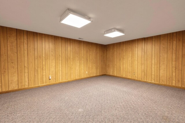 1541 Kensington Ln, Lancaster, OH 43130 - spare room featuring carpet and wood walls
