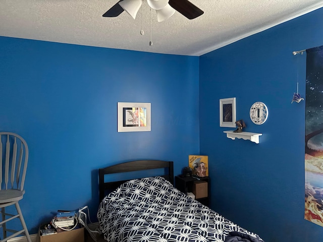4564 Pebble Beach Dr, Grove City, OH 43123 - bedroom with a textured ceiling and a ceiling fan