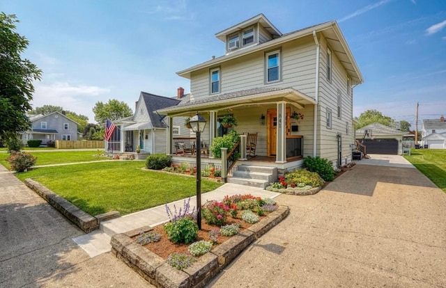 841 E Mulberry St, Lancaster, OH 43130 - american foursquare style home with covered porch, an outdoor structure, a front lawn, and a garage