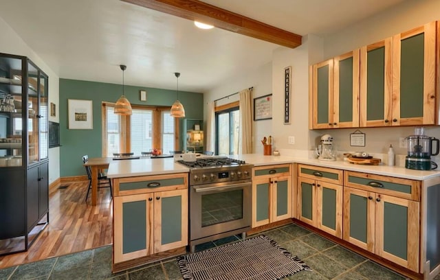 841 E Mulberry St, Lancaster, OH 43130 - kitchen with high end stainless steel range oven, a peninsula, light countertops, and beam ceiling