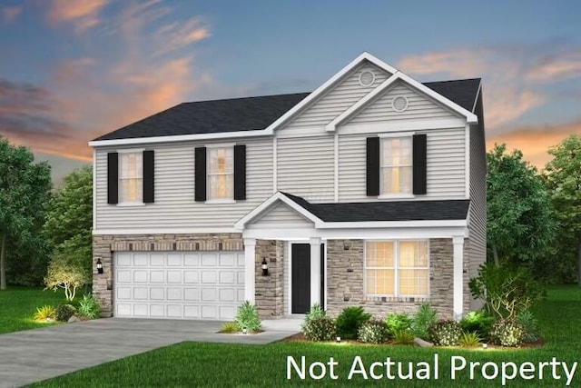 1283 Andean Dr Lot 69, Lockbourne, OH 43137 - traditional-style house with stone siding, a garage, driveway, and a lawn