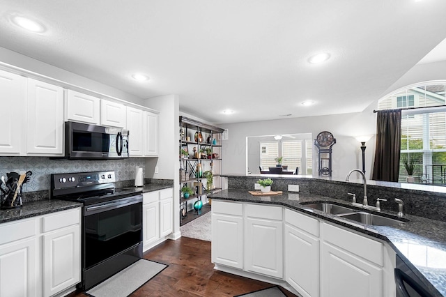 4481 Newport Loop E, Grove City, OH 43123 - kitchen with appliances with stainless steel finishes, a sink, dark wood-style flooring, white cabinets, and tasteful backsplash