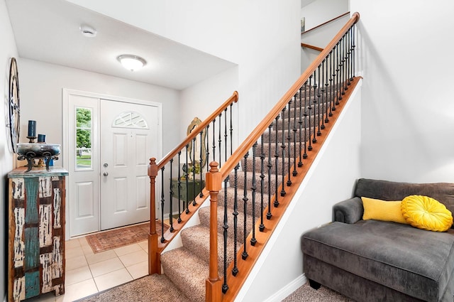 4481 Newport Loop E, Grove City, OH 43123 - entryway featuring stairway, baseboards, and tile patterned flooring