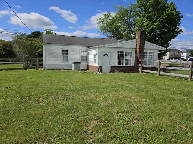 36 Johnson Rd, The Plains, OH 45780 - back of house featuring a chimney and cooling unit