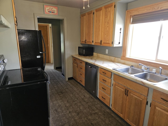 36 Johnson Rd, The Plains, OH 45780 - kitchen with black appliances, a sink, light countertops, and dark colored carpet