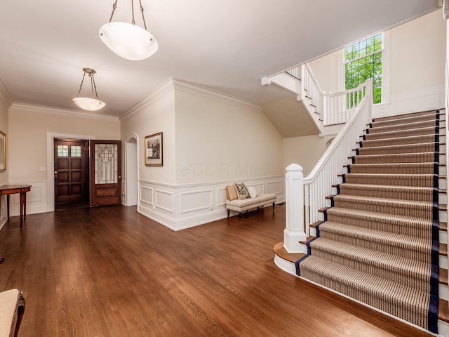 140 N Parkview Ave, Bexley, OH 43209 - foyer with stairs, wood finished floors, crown molding, a wainscoted wall, and a decorative wall